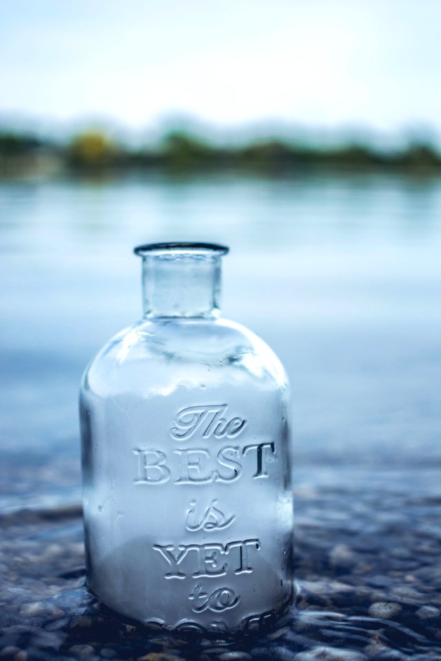 Clear Glass Jar In Body Of Water
