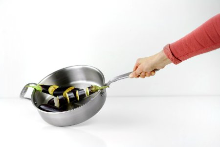 Person Holding Stainless Steel Casserole photo