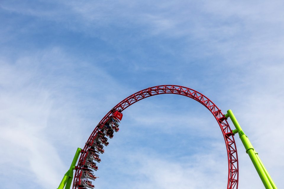 Red Roller Coaster Train On Top Of Rail