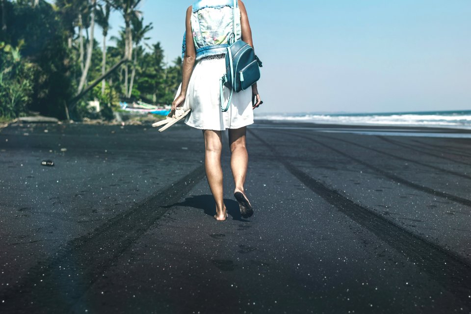 Woman Walking By The Sea