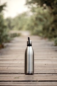 Vacuum Flask On Brown Wooden Dock photo