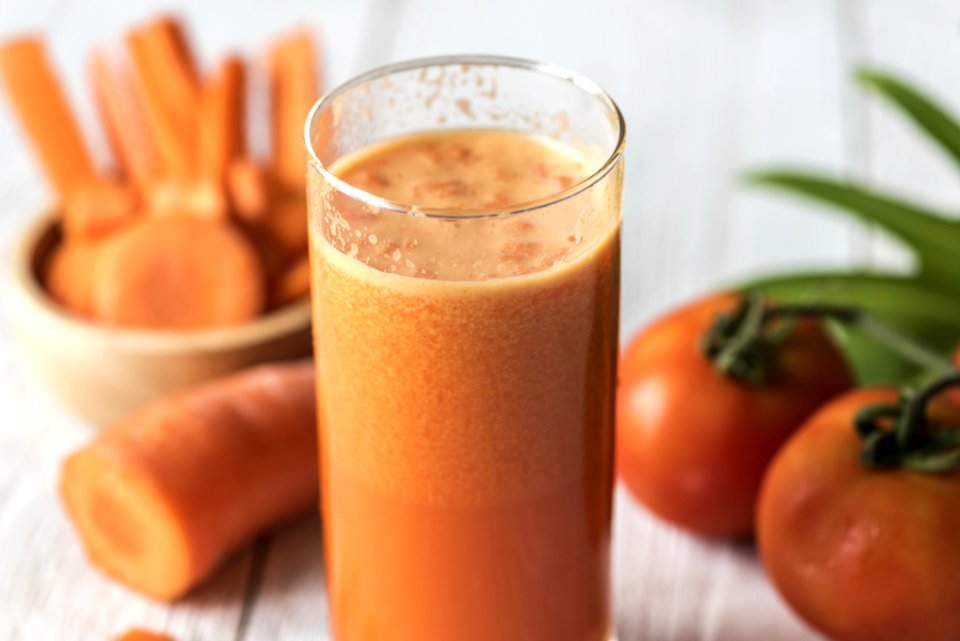 Tomatoes And Carrot Juice On Highball Glass