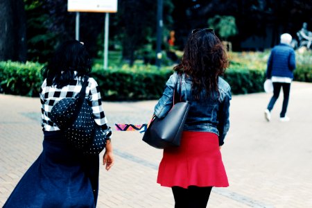 Woman In Blue Denim Jacket And Red Skirt photo