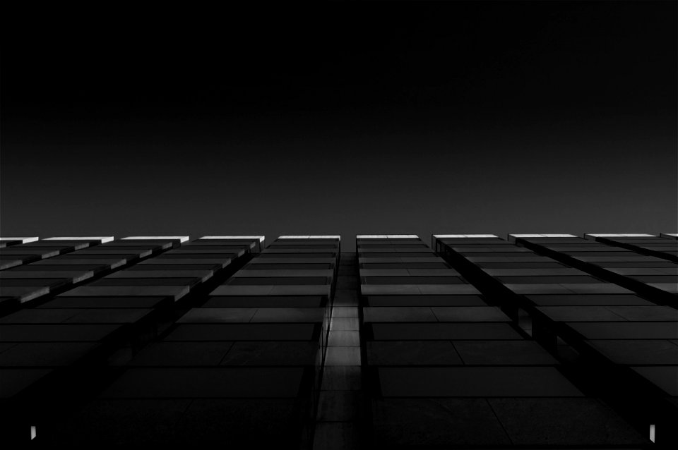 Grayscale Photo Of High Rise Building