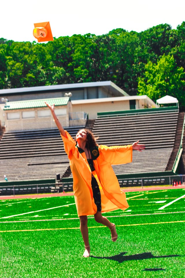 Woman In Orange Academic Dress