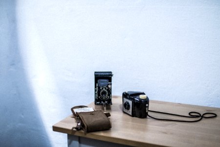 Black And Gray Folding Camera On Table photo