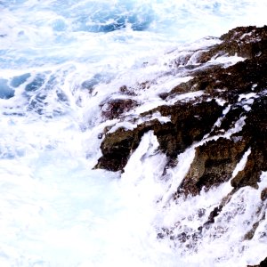 Ocean Waves Crashing On Rock Formation photo
