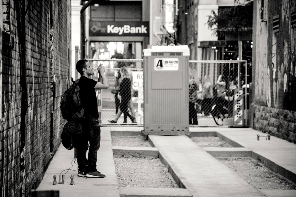 Man Standing Near Keybank Signage
