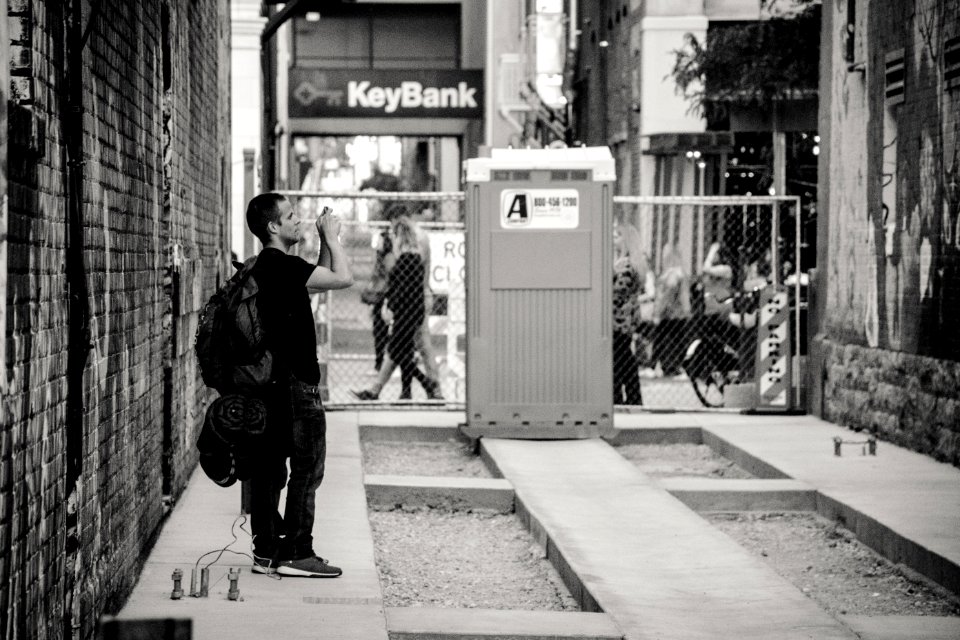 Man Standing Near Keybank Signage photo