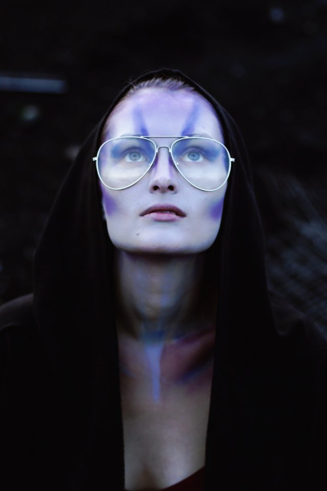 Woman With Black Pullover Hoodie With Gold Aviator-style Eyeglasses