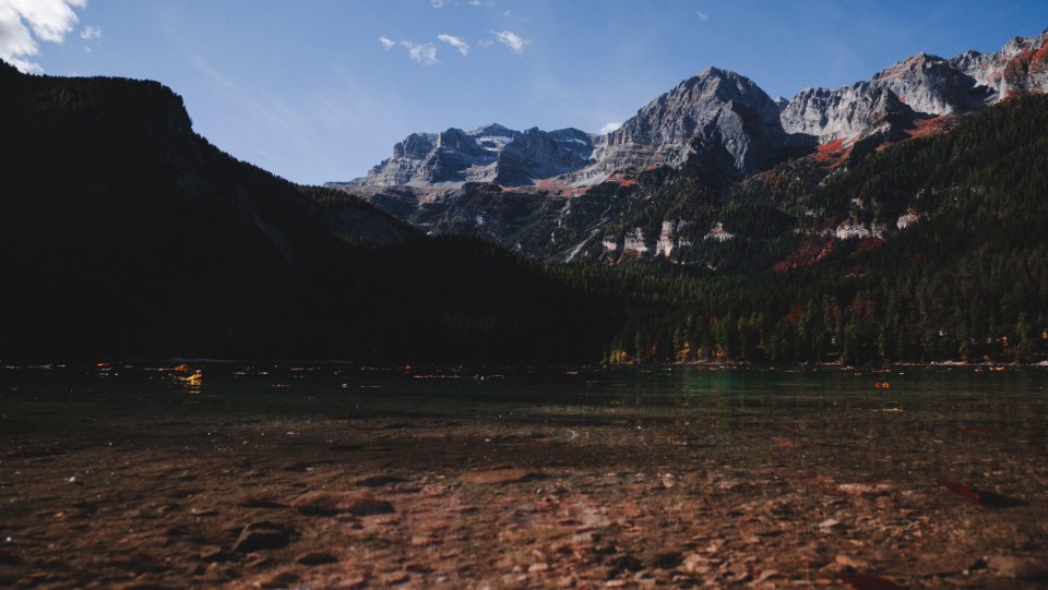 Body Of Water Beside Mountain