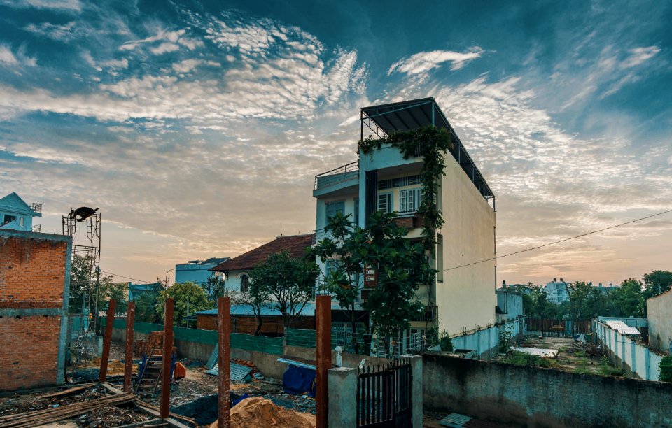 White Concrete Building Under Cumulus Clouds