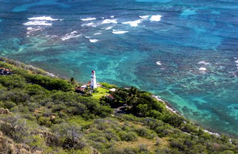 Aerial Photo Of White Lighthouse Near Beach And Trees photo