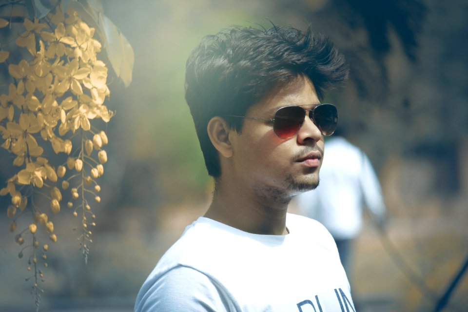 Tilt Shift Lens Photography Of Man Wearing White Crew-neck Top