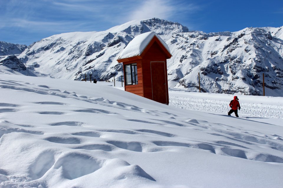 Person Doing Snow Ski Near House
