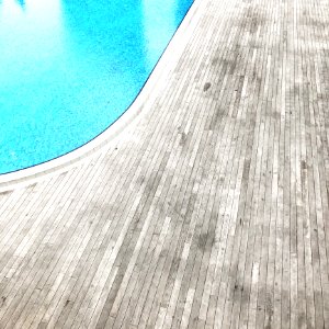 Wooden Floor Beside Pool photo