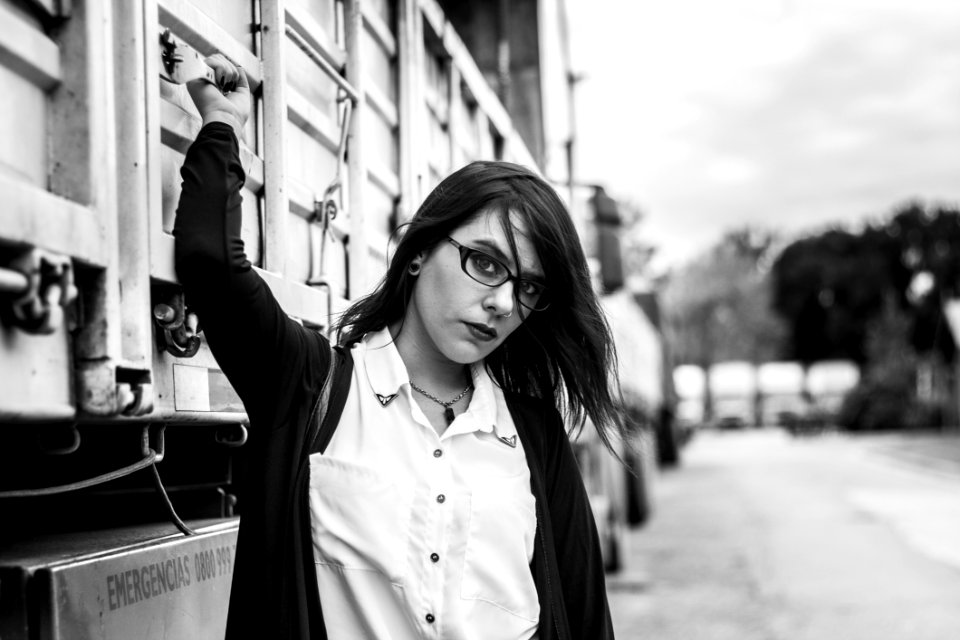 Woman With Zip-up Jacket Stand Beside Truck