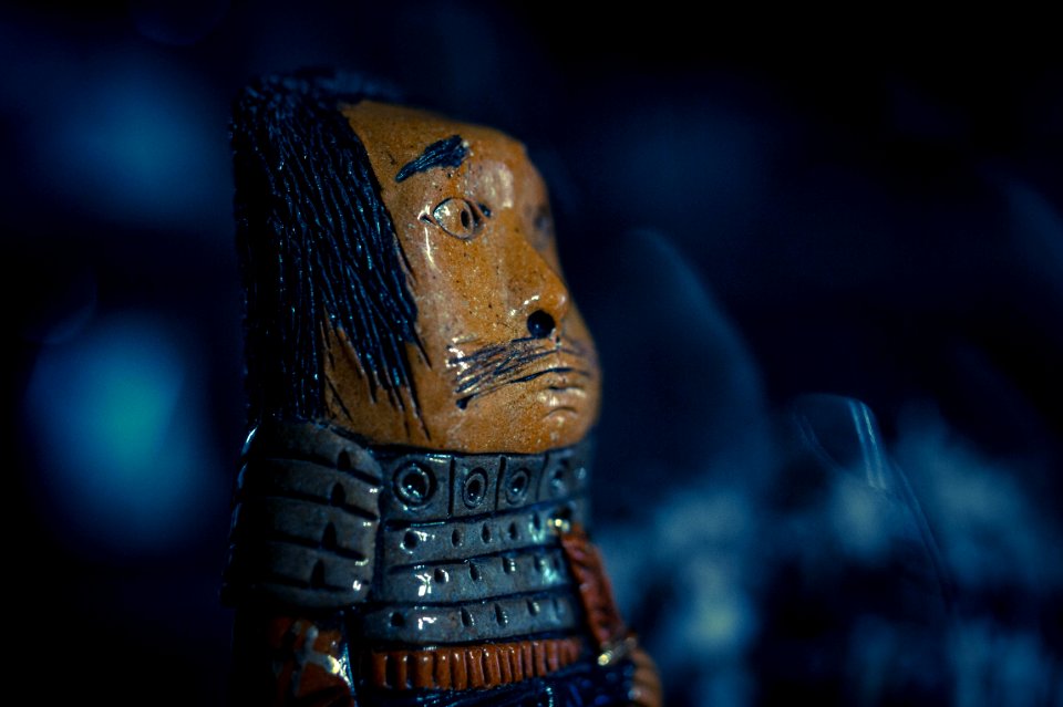 Brown And Gray Warrior Figure Closeup Photo