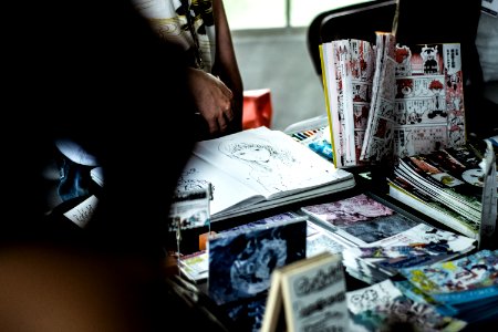 Shallow Focus Photo Of Comic Books