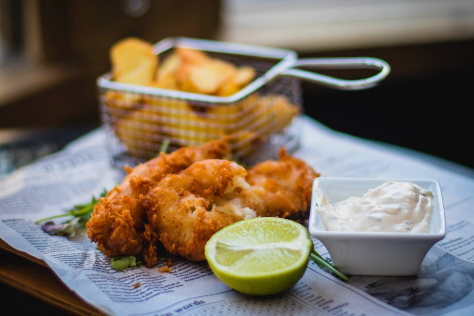 Fried Meat Beside Sliced Lemon And White Mustard photo