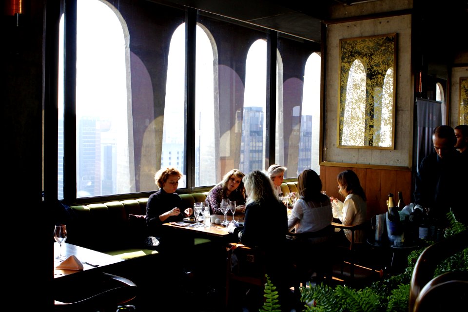 Group Of People Sits Near Table