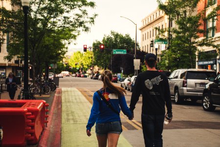 Man And Woman Holds Hands While Walking photo