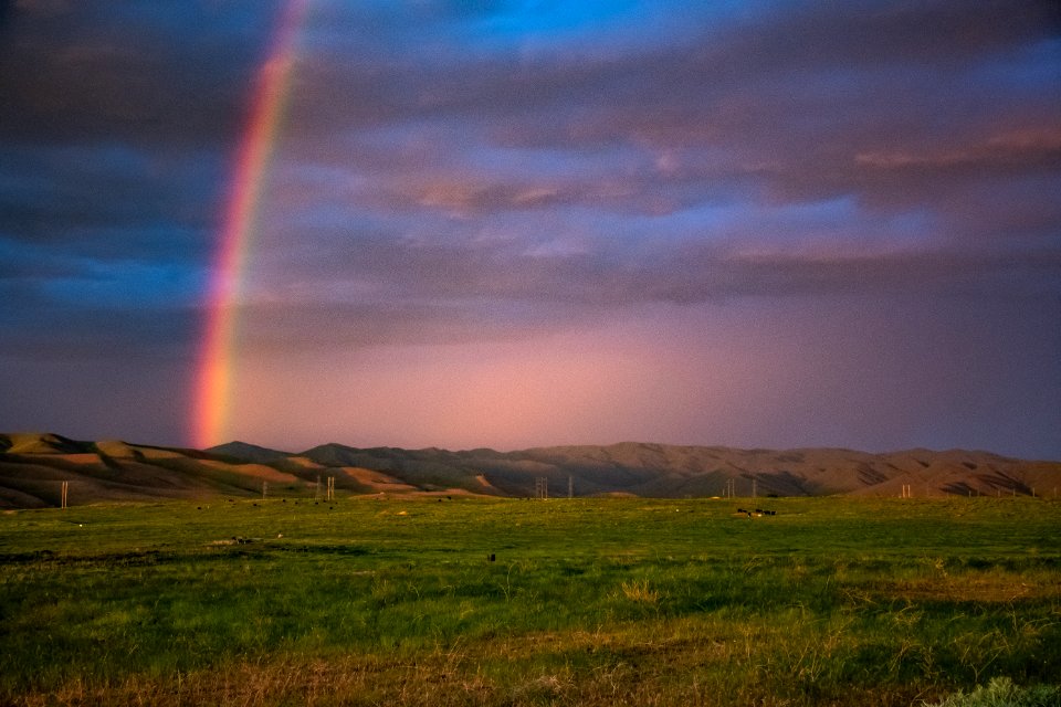 Landscape Photography Of Mountains With Rainbow