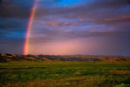 Landscape Photography Of Mountains With Rainbow