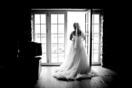 Grayscaled Photography Of Woman Wearing Wedding Dress photo