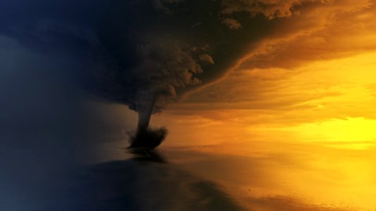 Tornado On Body Of Water During Golden Hour