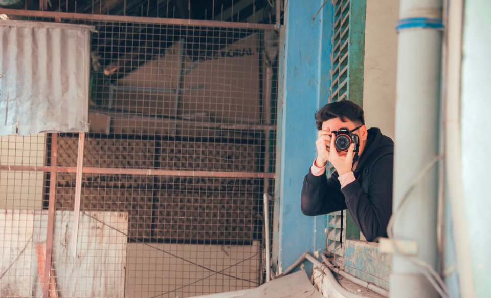 Man Holding Dslr Camera