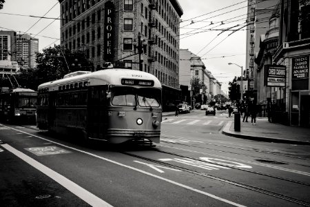 Grayscale Photography Of Tram Near Buildings photo