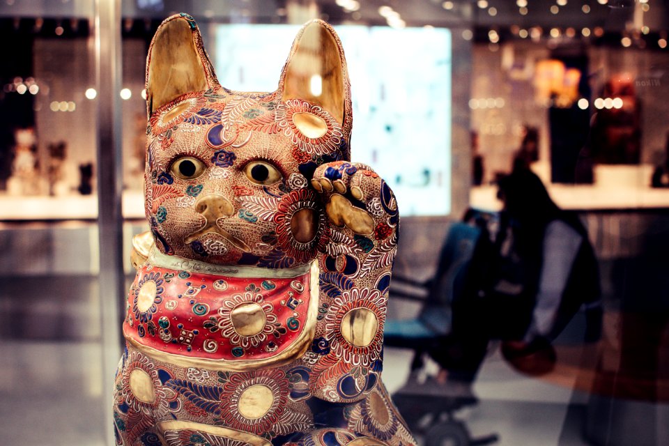 Shallow Focus Photography Of Maneki-neko Figurine