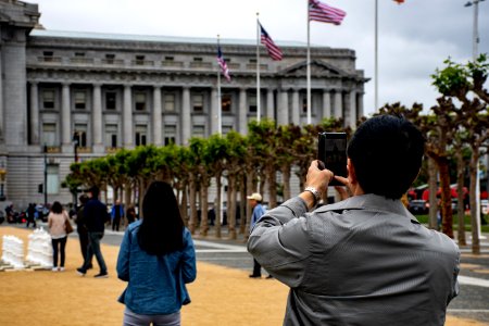 Man Using Smartphone To Capture Photo photo
