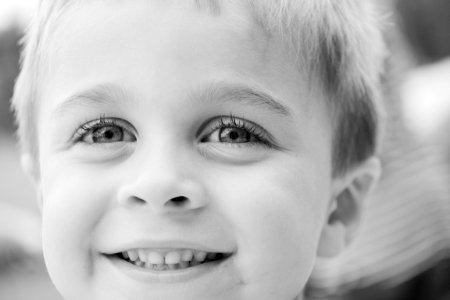 Grayscale Photo Of Toddler Smiling photo