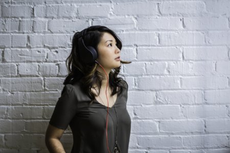 Woman Looking Up While Wearing Headphones photo