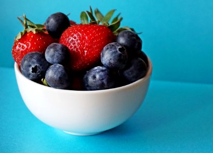 Blueberries And Strawberries In White Ceramic Bowl photo