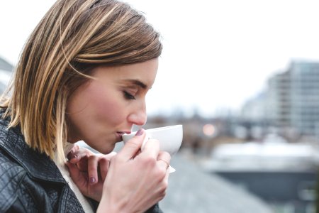 Woman Drinking On Teacup