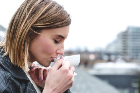 Woman Drinking On Teacup photo