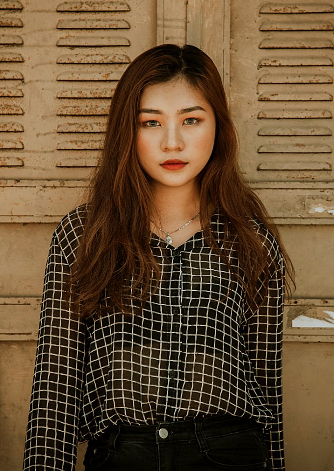 Woman Wearing White And Black Tattersall Collared Button-up Blouse Standing Near Brown Wall