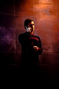 Man In Red And Purple Striped Henley Shirt