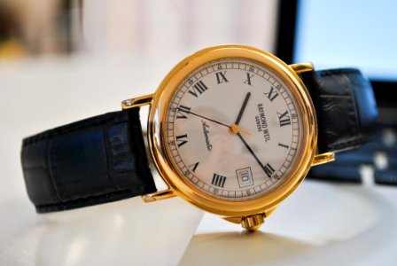 Round Gold-colored Analog Watch With Black Leather Strap At 1010 photo