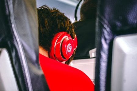 Man Wearing Red Beats By Dre Headphones