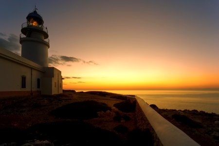 White Concrete Lighthouse During Golden Hour photo