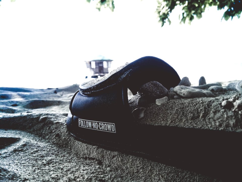 Black Textile On Gray Sand