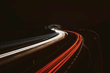 Time Lapse Photography Of Vehicles On Road During Nightime photo