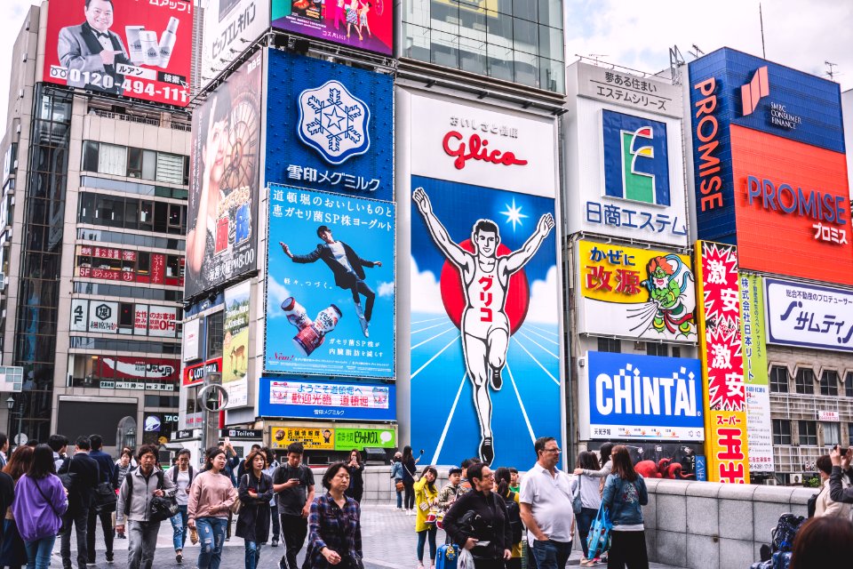 People Walks Near Electronic Billboards photo