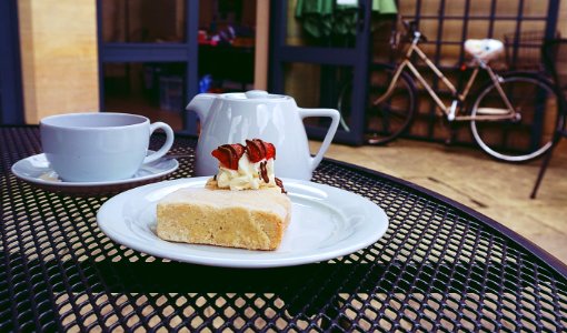 Cake On Ceramic Plate Near Teapot And Cups photo