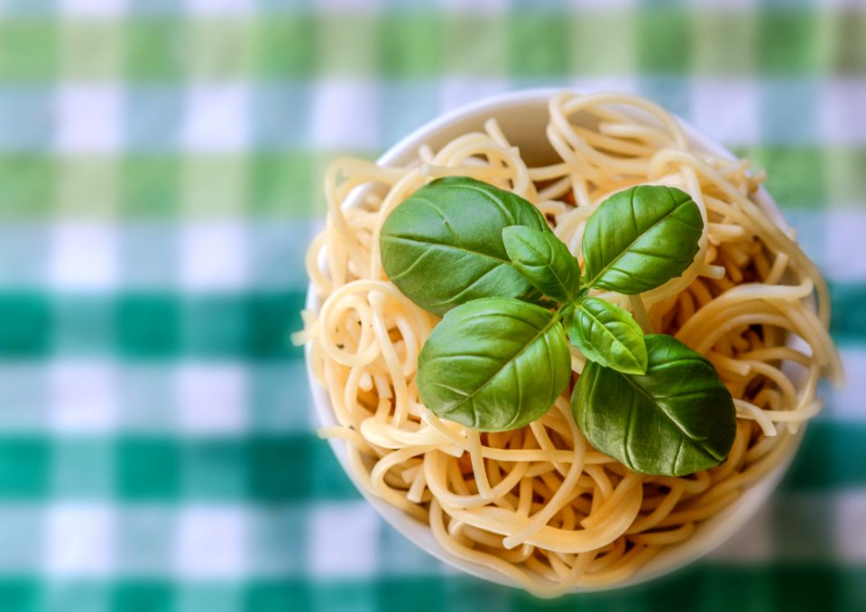 Selective Focus Photo Of Noddles With Green Leaf Toppings
