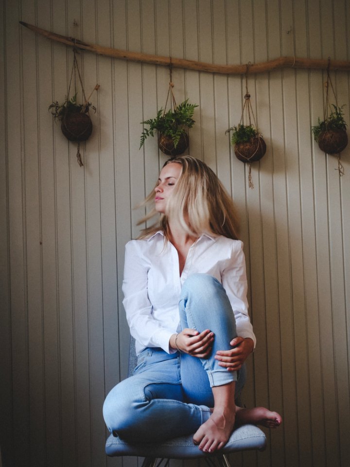 Photo Of Woman Sitting On Chair